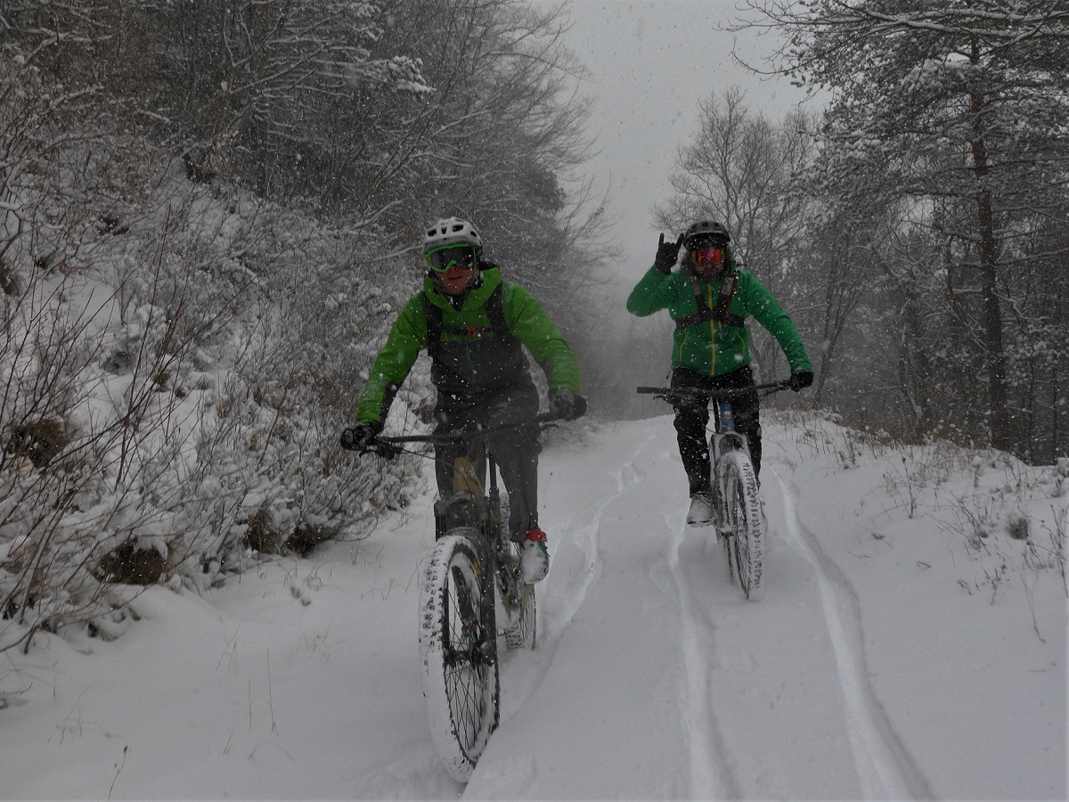 Throw horns and smile. Biking in the snow is infinitely better than not biking at all.